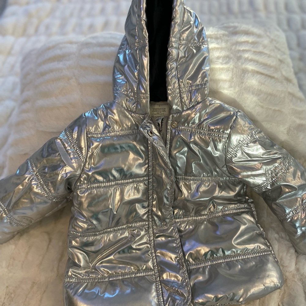 First Impressions Light weight silver puffer jacket wth hood. 12 months.